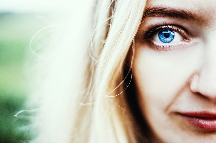 selective photograph of woman with blue eyes