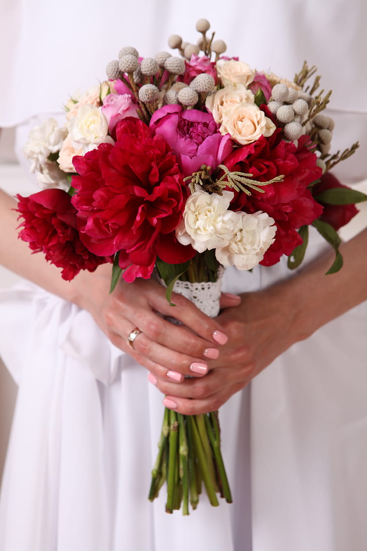 red carnation flowers and white rose flowers wedding bouquet