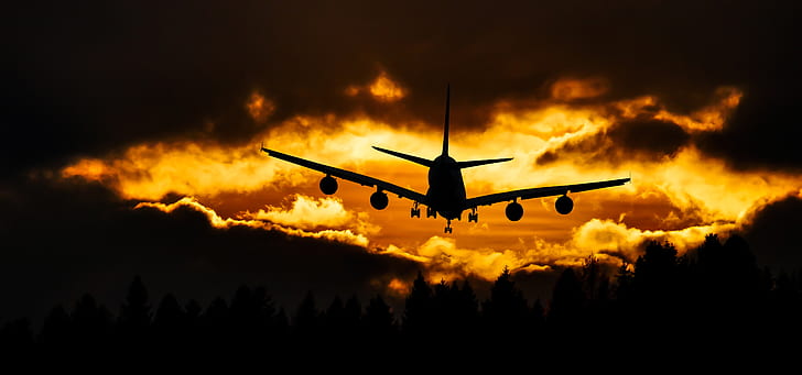 silhouette of plane and clouds