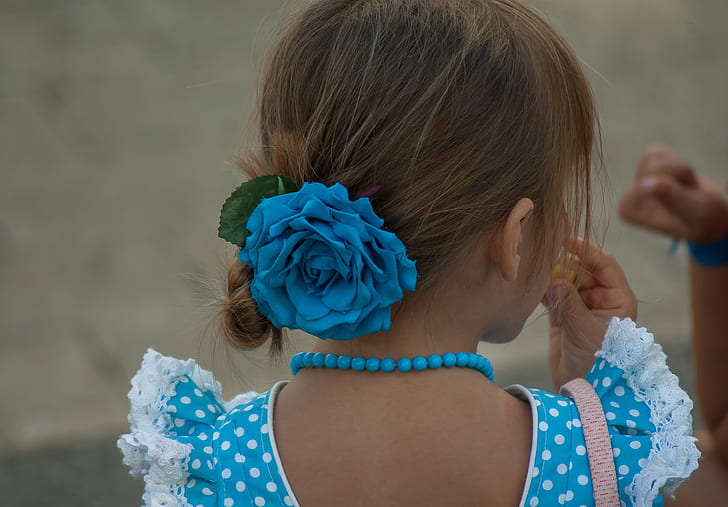 girl wearing blue floral hair bow