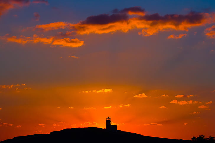 photography of lighthouse during golden hour