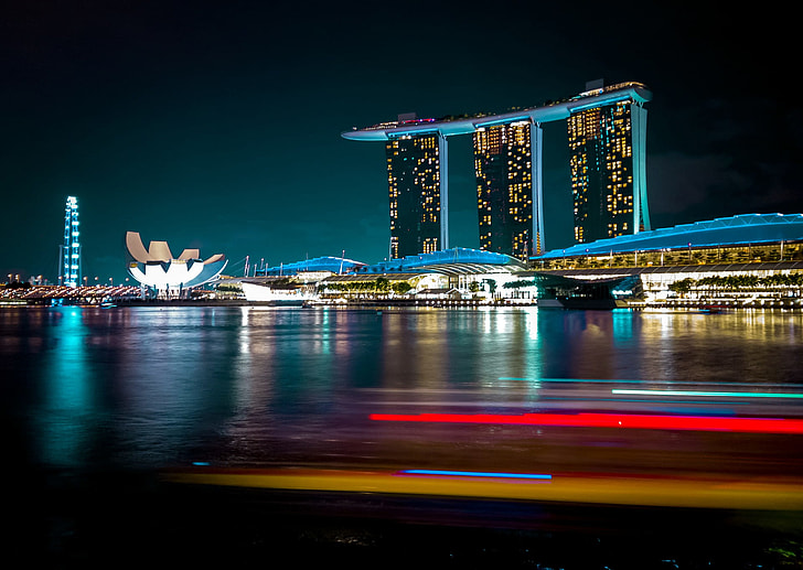 timelapse photography of city high-rise buildings during night time