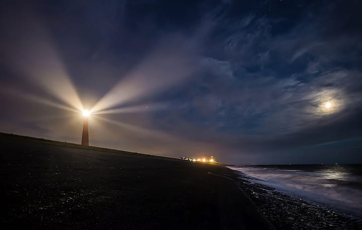 landscape photography of light house near body of water