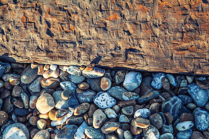 This is a shot captured on the beach at Deal In Kent England, the beach pebbles rest beside an old wooden groyne