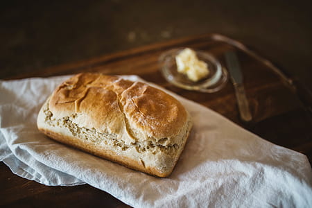 baked bread on white textile