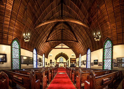 brown wooden pews in church