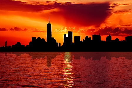silhouette of New York city skyline at sunset
