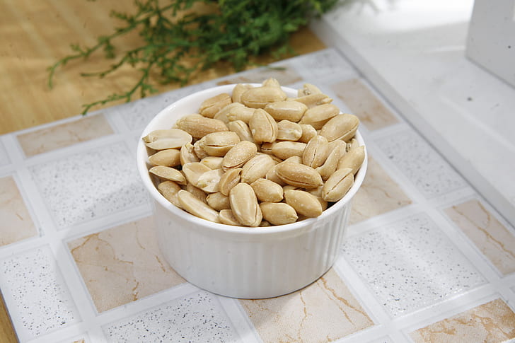 close up photograph of white ramekin with nuts