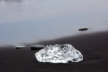 clear photography of a chrystal fragment in black surface