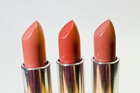 three pink and red lipsticks