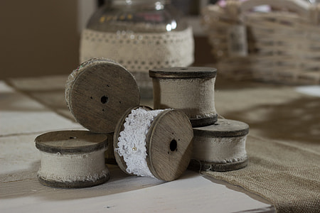 brown wooden spools on table top