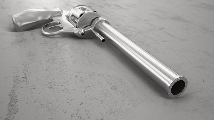 silver revolver on top of gray surface