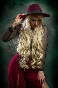 long blonde-haired woman wearing purple hat