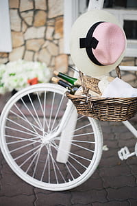 brown woven basket on white commuter bike
