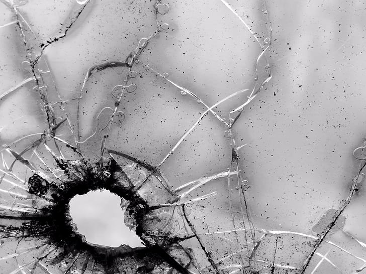 grayscale close up photography of shattered glass