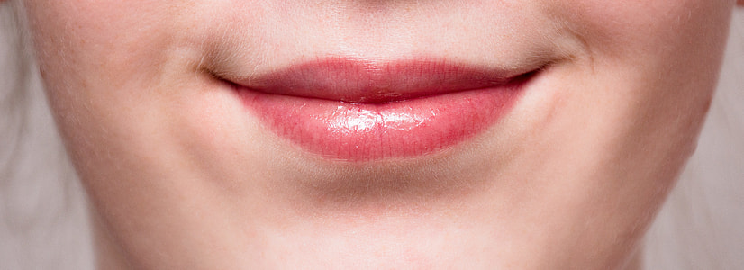 closeup photo of woman's red lipstick