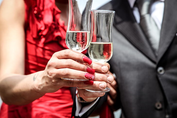 man and woman holding glass of champagne