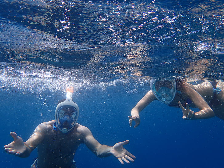 Photo of People Snorkeling Underwater