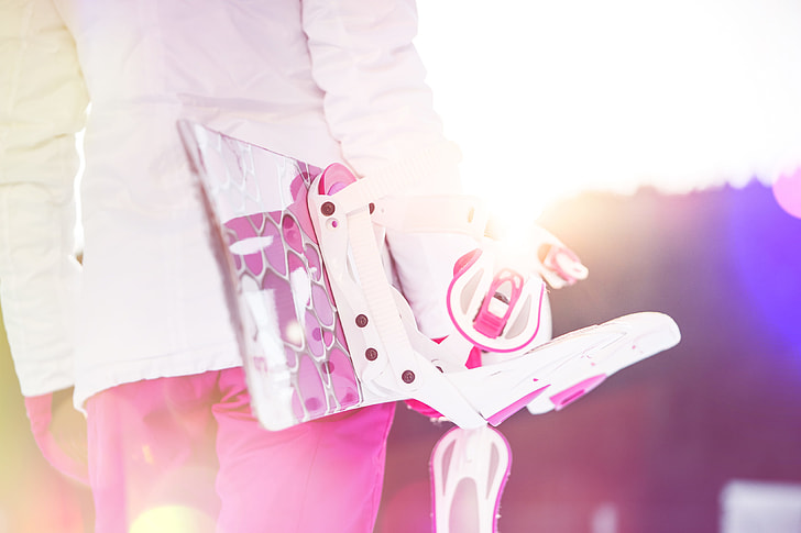 Young Woman Holding Her Pink Snowboard