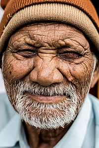 man wearing brown knit cap close up photo