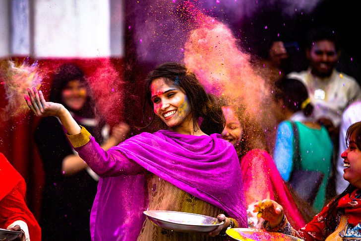 woman wearing sari near people