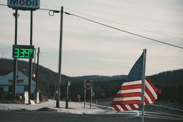 US flag near gasoline station