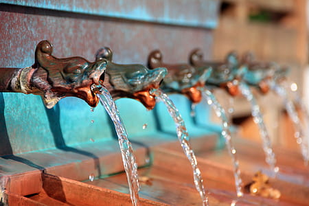 blue and brown metal water fountain pipes