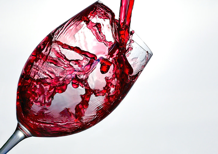 clear wine glass with red liquid