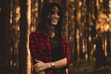 woman in black and red flannel shirt shallow focus photography