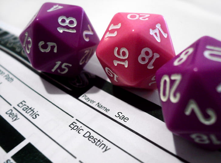 close-up photography of three assorted-color dice
