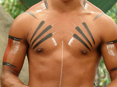 man with tribal tattoo