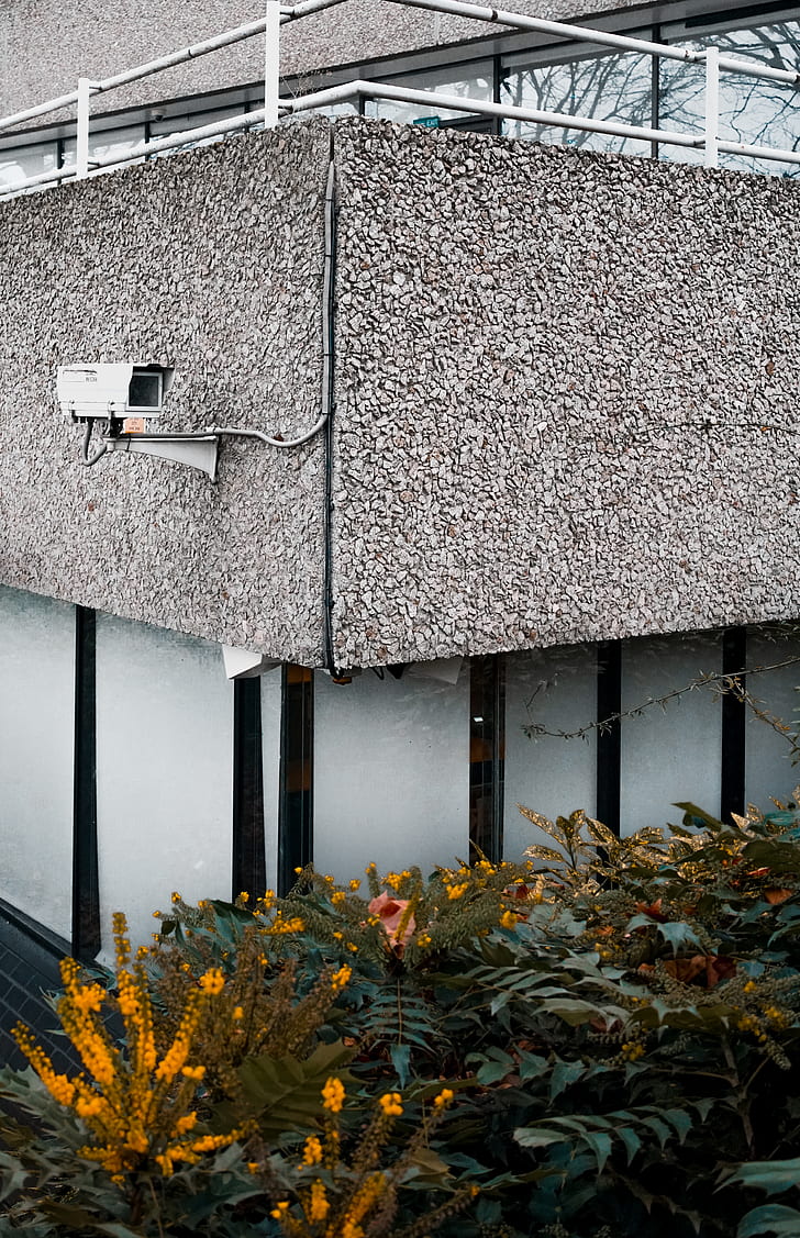 white bullet-type surveillance camera