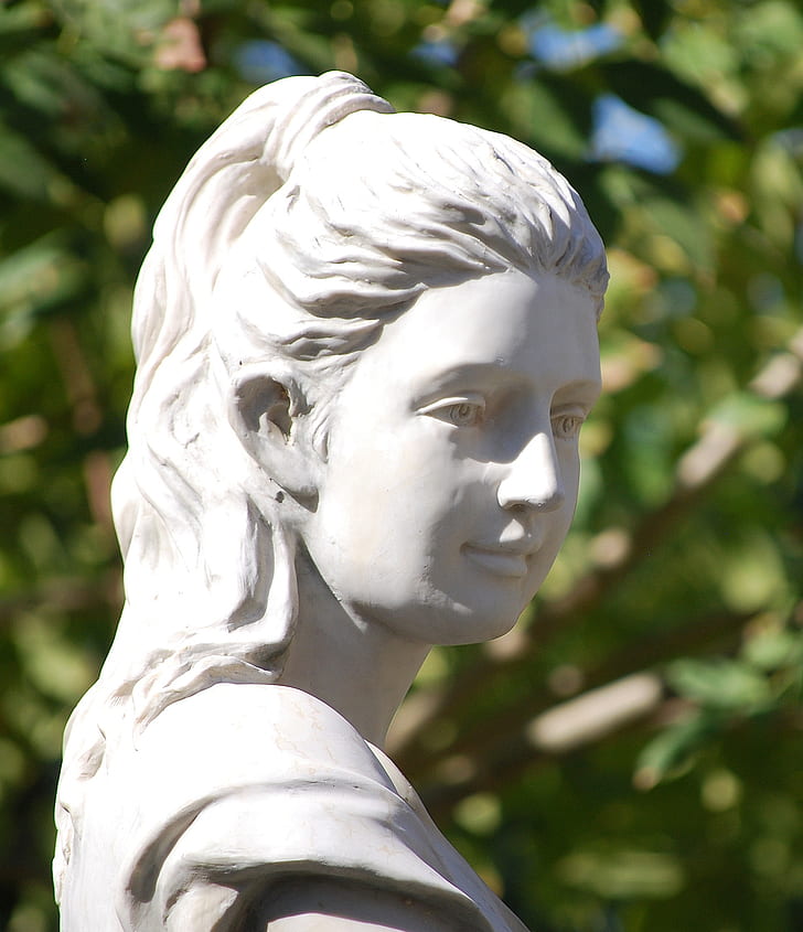 woman white figurine during daytime