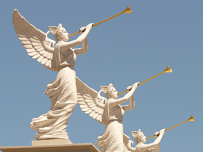 three angels playing wind instrument statues