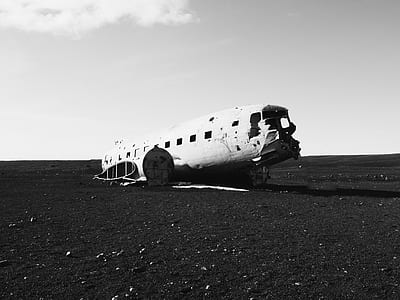 grayscale photo of plane wreck