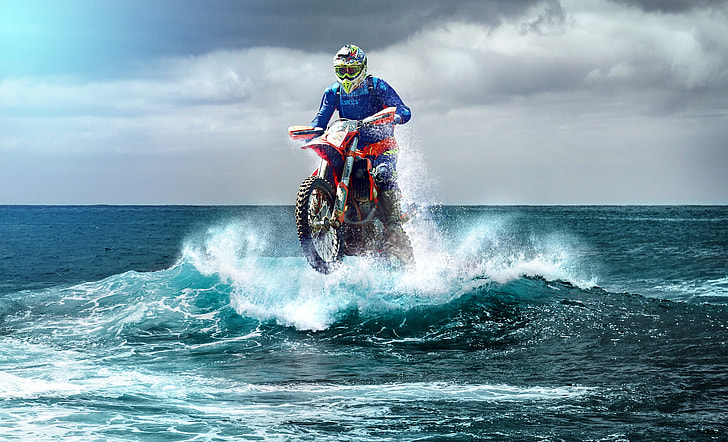 person ride on motocross dirt bike on body of water