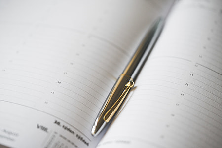 Silver Pen in Open Business Day Planner Diary