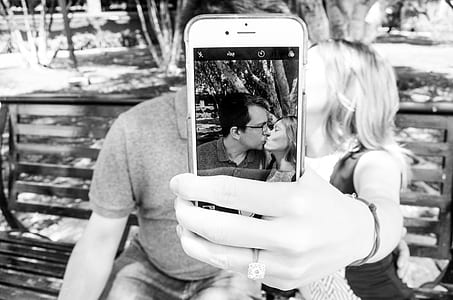 Gray Scale Photo of Man and Woman Taking a Selfie
