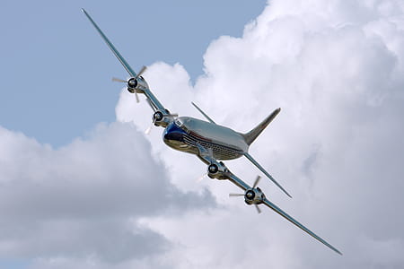 Chrome Airplane Flying during Daytime