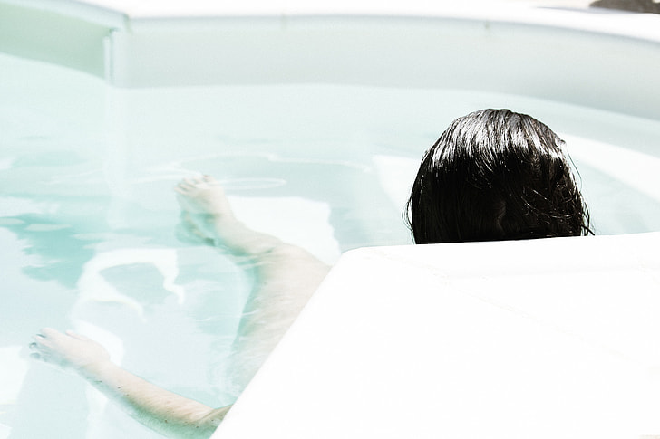woman lying down on Jacuzzi