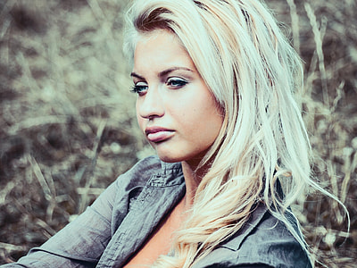 portrait photography of blonde woman in gray jacket