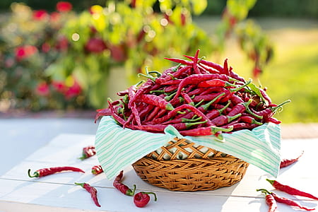 red chili in brown wicker basket