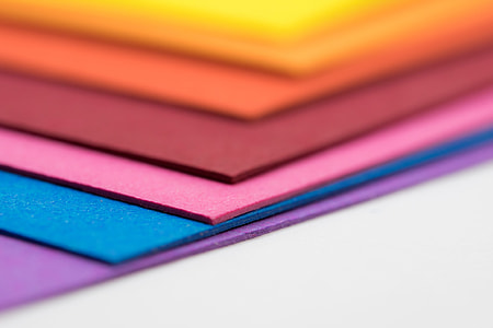 tilt shift photo of assorted-color papers