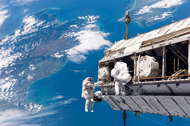 two astronaut on white space shuttle