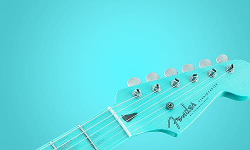 teal Fender guitar headstock