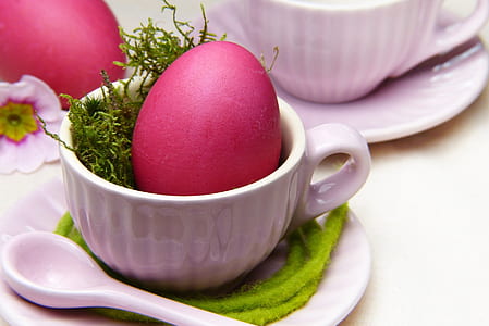 pink egg on white ceramic teacup