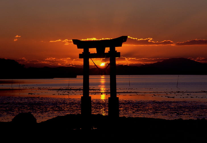 silhouette scenery of Japanese structure during sunset
