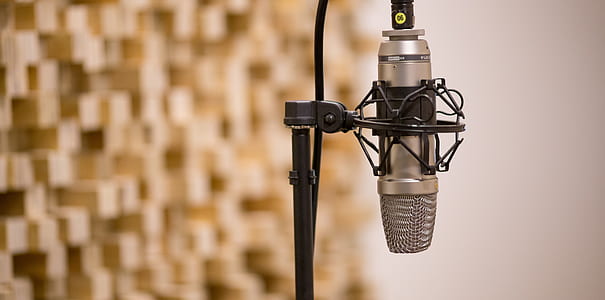 silver microphone on black steel stand