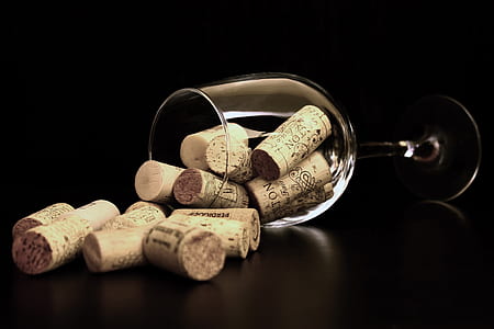 Brown Corks on Clear Wine Glass