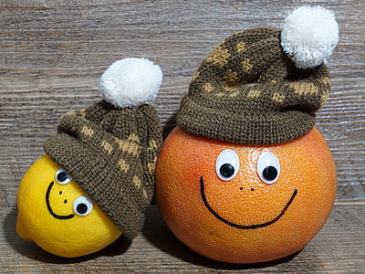 yellow lemon and orange fruit with brown knit caps decor